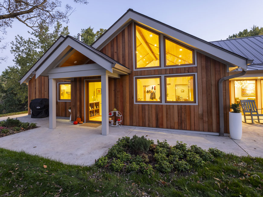 Night time shot of rear terrace of newly remodeled home in Kentucky by Kepes Architecture.