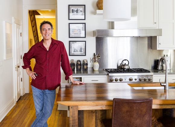 Architect Chris Kepes standing in renovated kitchen